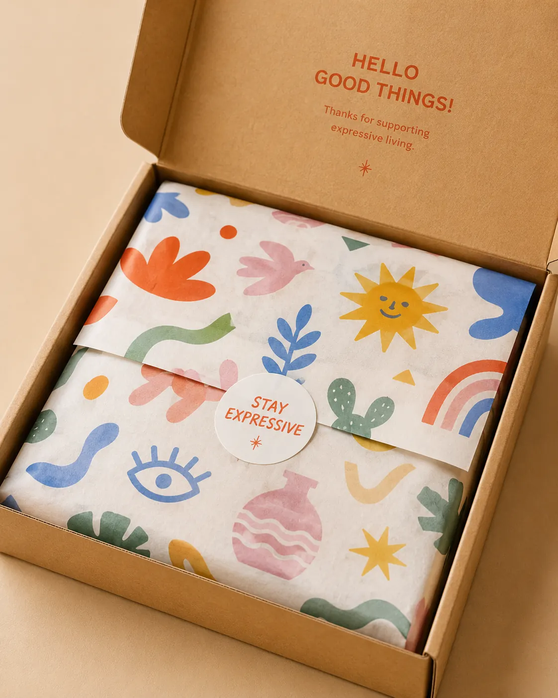 Expressive Carry System material samples - kraft paper, illustrated tissue, die-cut stickers and woven rope handles